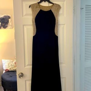 Xscape black, nude, and silver studded formal gown. Size 10.